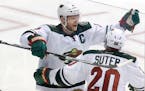 Minnesota Wild center Mikko Koivu (9) celebrates his goal with defenseman Ryan Suter (20) during overtime in Game 5 in the first round of the NHL Stan