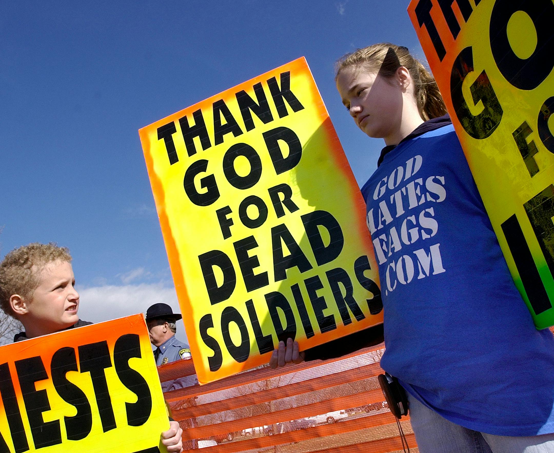 FILE - In this March 10, 2006, file photo, Westboro Baptist church member Gabriel Phelps-Roper, 10, and his sister Grace Phelps-Roper, 13, both of Topeka, Kan., protest at the funeral of Marine Lance Cpl. Matthew A. Snyder in Westminster, Md. More than four years after Lance Cpl. Snyder died in a Humvee accident in Iraq, his father Albert Snyder's legal battle against the Westboro Baptist Church is headed to the Supreme Court. (AP Photo/Carroll County Times, Dylan Slagle) NO SALES ORG XMIT: MIN2