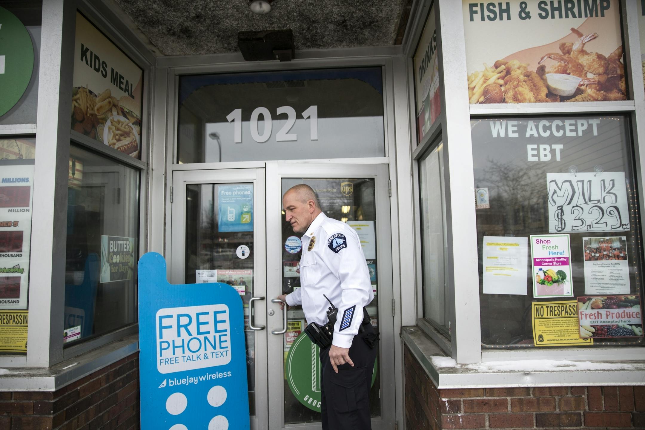 Inspector Mike Friestleben of the Minneapolis Police Department's Fourth Precinct walks into a grocery store on Broadway in north Minneapolis on Thursday, February 4, 2016.