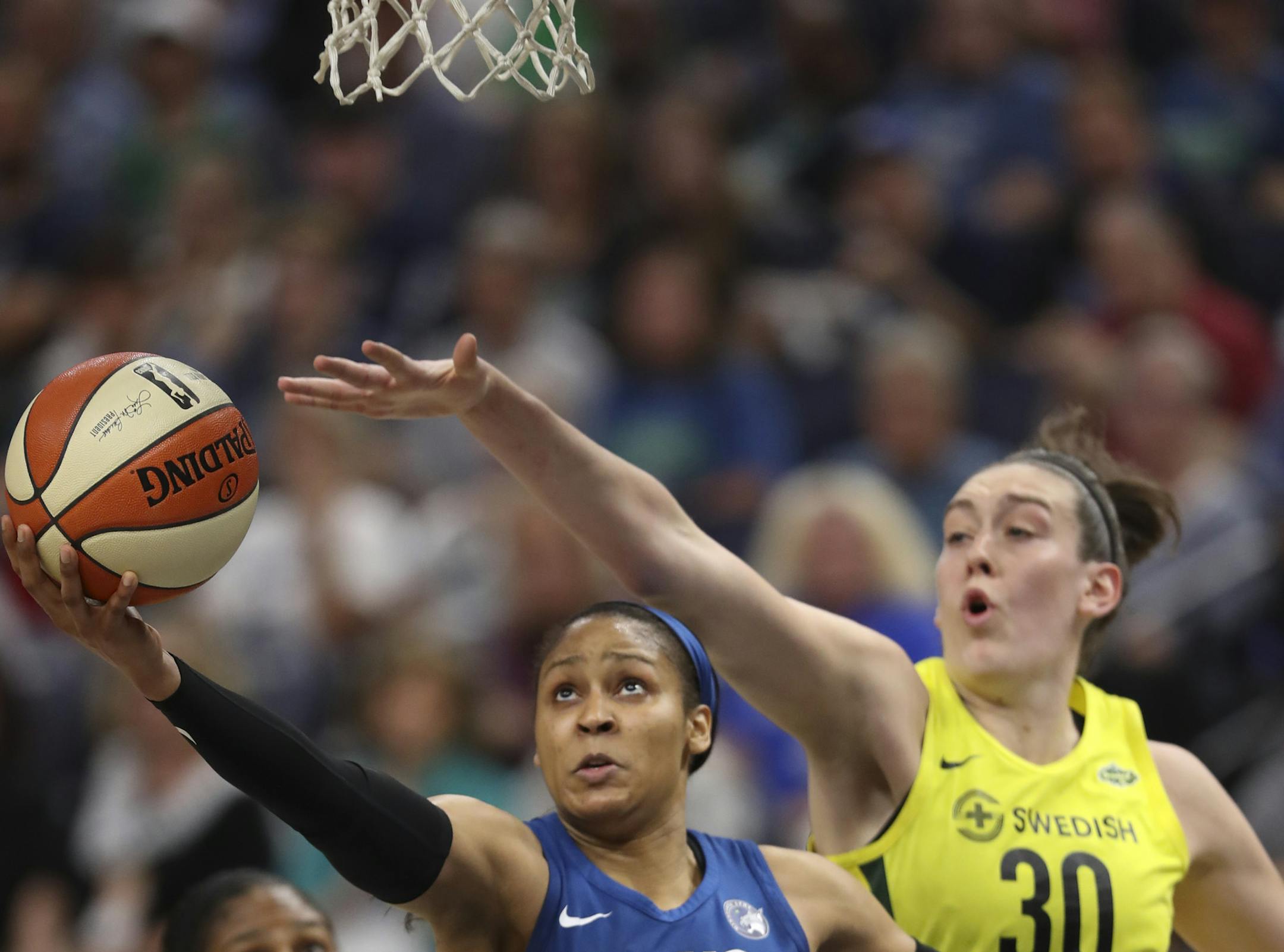 Minnesota Lynx forward Maya Moore (23) shot under the hoop while defended by Seattle Storm forward Breanna Stewart (30) in the second quarter. ] JEFF WHEELER ï jeff.wheeler@startribune.com The Minnesota Lynx faced the Seattle Storm in an WNBA basketball game Tuesday night, June 26, 2018 at Target Center in Minneapolis.