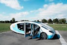 The solar-powered vehicle is on display on a closed road, in Guyancourt, south of Paris, Friday Sept. 24, 2021. A group of Dutch students has reimagin