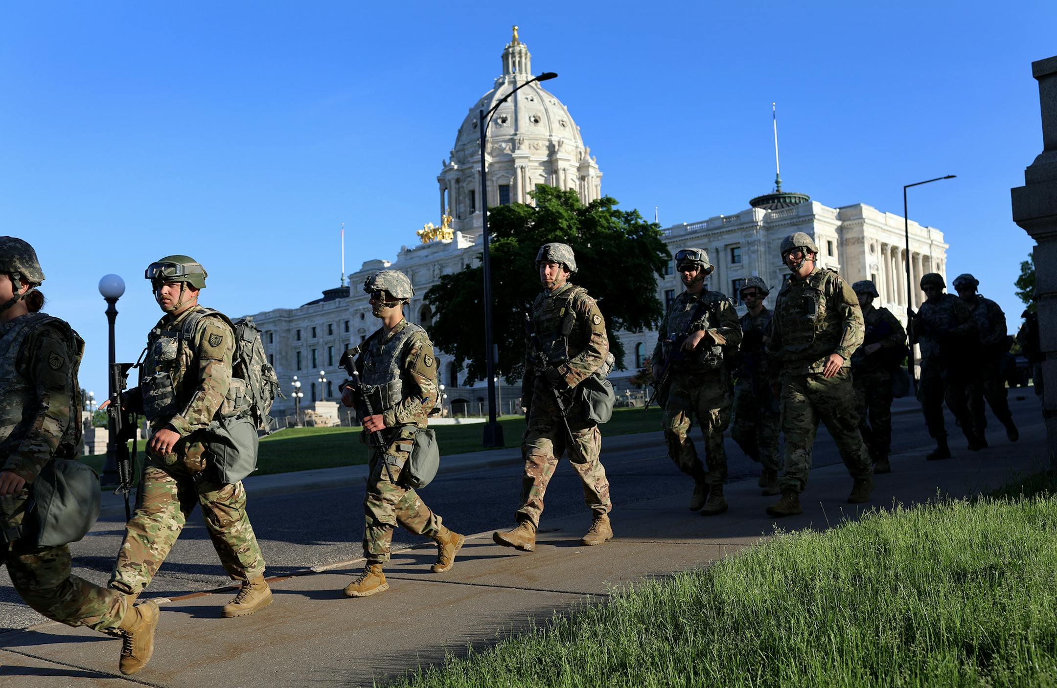 Minnesota National Guard members walk near the State Capitol to replace fellow soldiers on duty near the Capitol Tuesday, June 2, 2020, in St. Paul, MN.] DAVID JOLES • david.joles@startribune.com Latest on the death of George Floyd.