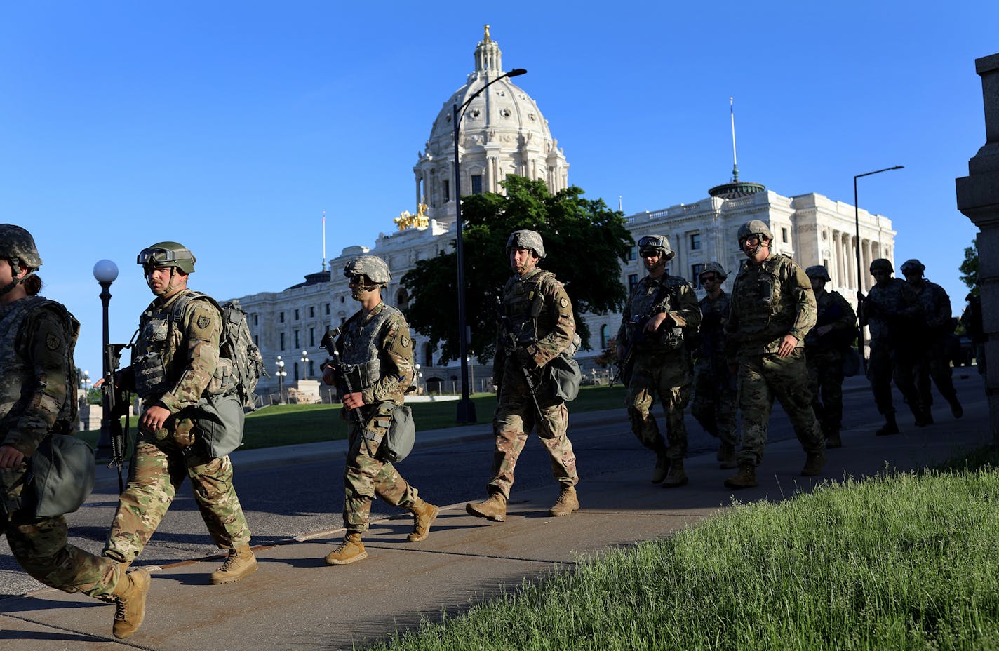 Minnesota National Guard members walk near the State Capitol to replace fellow soldiers on duty near the Capitol Tuesday, June 2, 2020, in St. Paul, MN.] DAVID JOLES • david.joles@startribune.com Latest on the death of George Floyd.