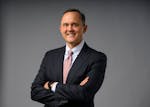 David Royal, Chief Investment Officer and Chief Financial Officer with Thrivent Financial, stands for a portrait Monday, Dec. 11, 2023 at the Star Tri