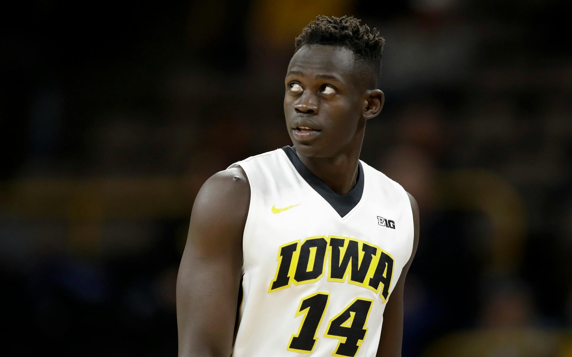Iowa guard Peter Jok walks on the court during the first half of an NCAA college basketball game against Stetson, Monday, Dec. 5, 2016, in Iowa City, Iowa. Iowa won 95-68. (AP Photo/Charlie Neibergall)