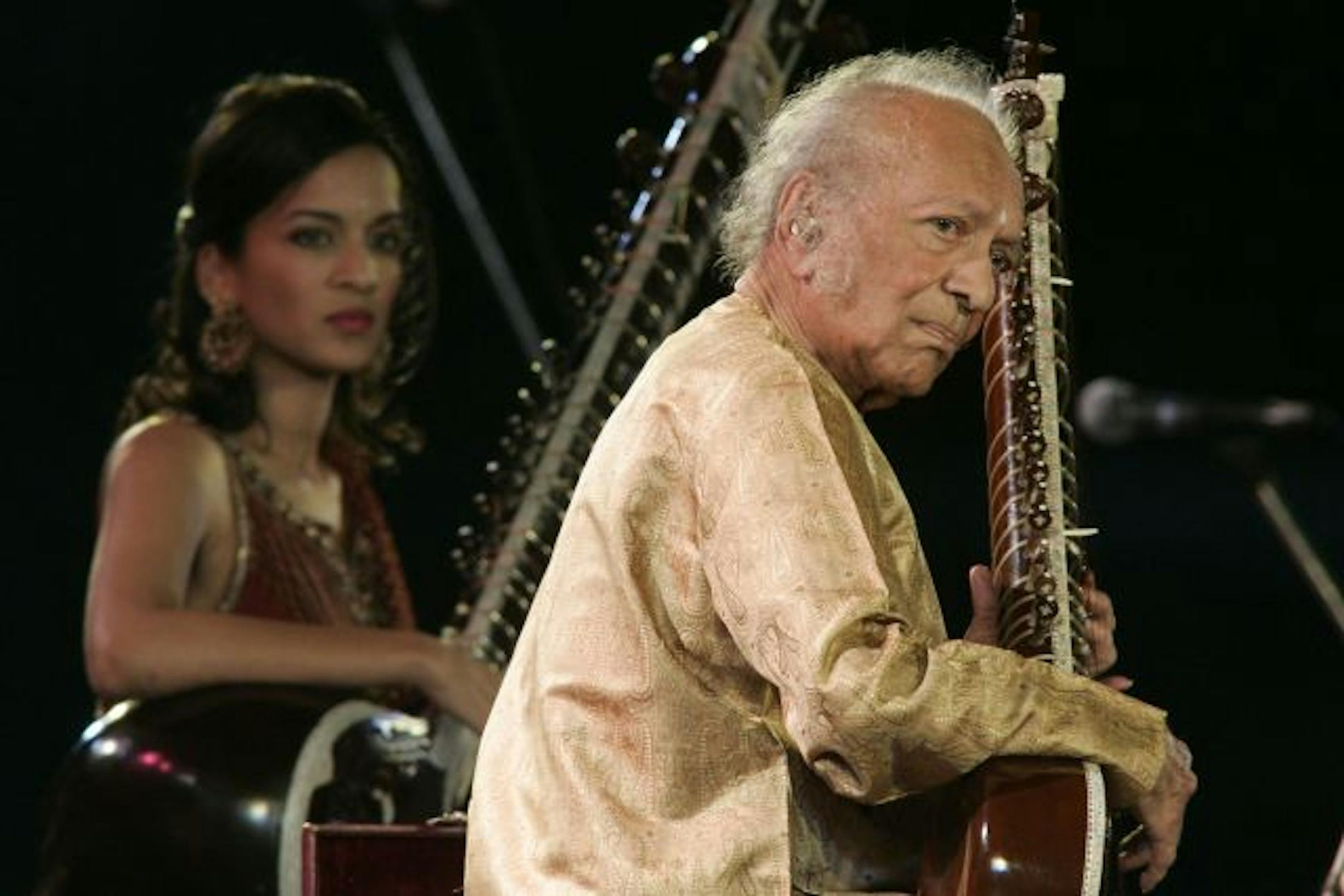 Legendary sitar player Ravi Shankar, right, performs with his daughter Anoushka Shankar in Calcutta, India, Saturday, Feb. 7, 2009.