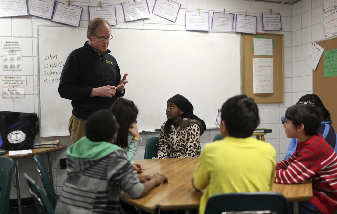 Co-fifth grade math teacher and math interventionist Paul Berge worked with a group of fifth grade students in his class using iPads and an app called Socrative to test students and get immediate feedback on how they are doingWednesday, Feb. 27, 2013, in Burnsville, MN.] (DAVID JOLES/STARTRIBUNE) djoles@startribune.com There is too much racial diversity at Sky Oaks Elementary in Burnsville and the school district has to come up with a plan to change the concentration of non-white students at the