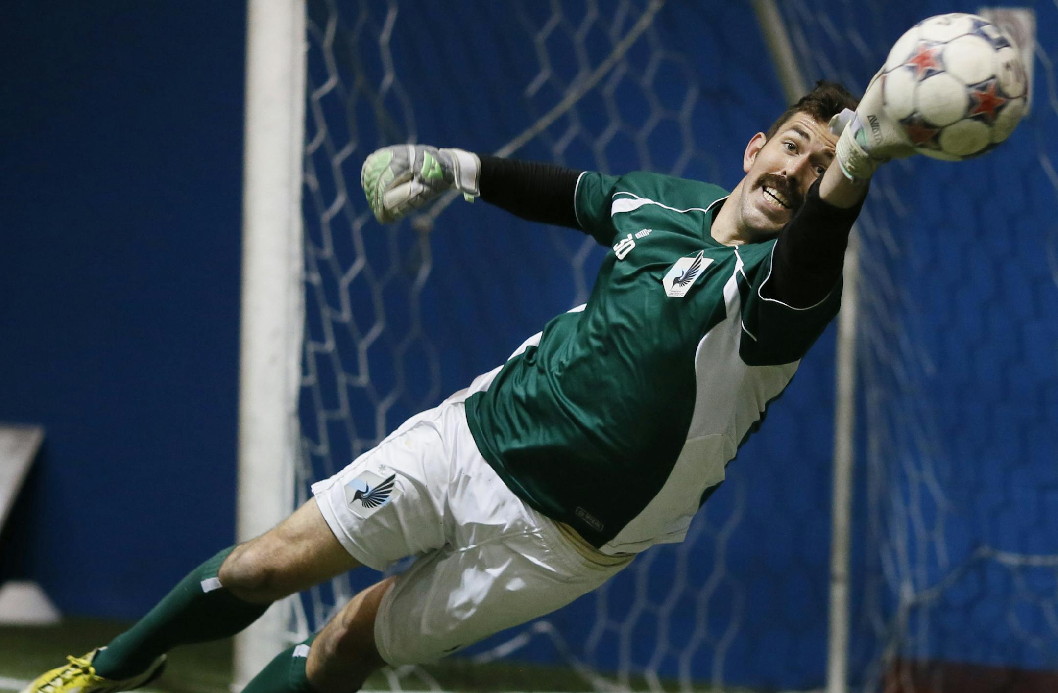 Goal keeper Matt VanOekel tipped a ball away for the the net during Minnesota United soccer practiceThursday April 24 , 2014 in Blaine, MN. ] JERRY HOLT jerry.holt@startribune.com
