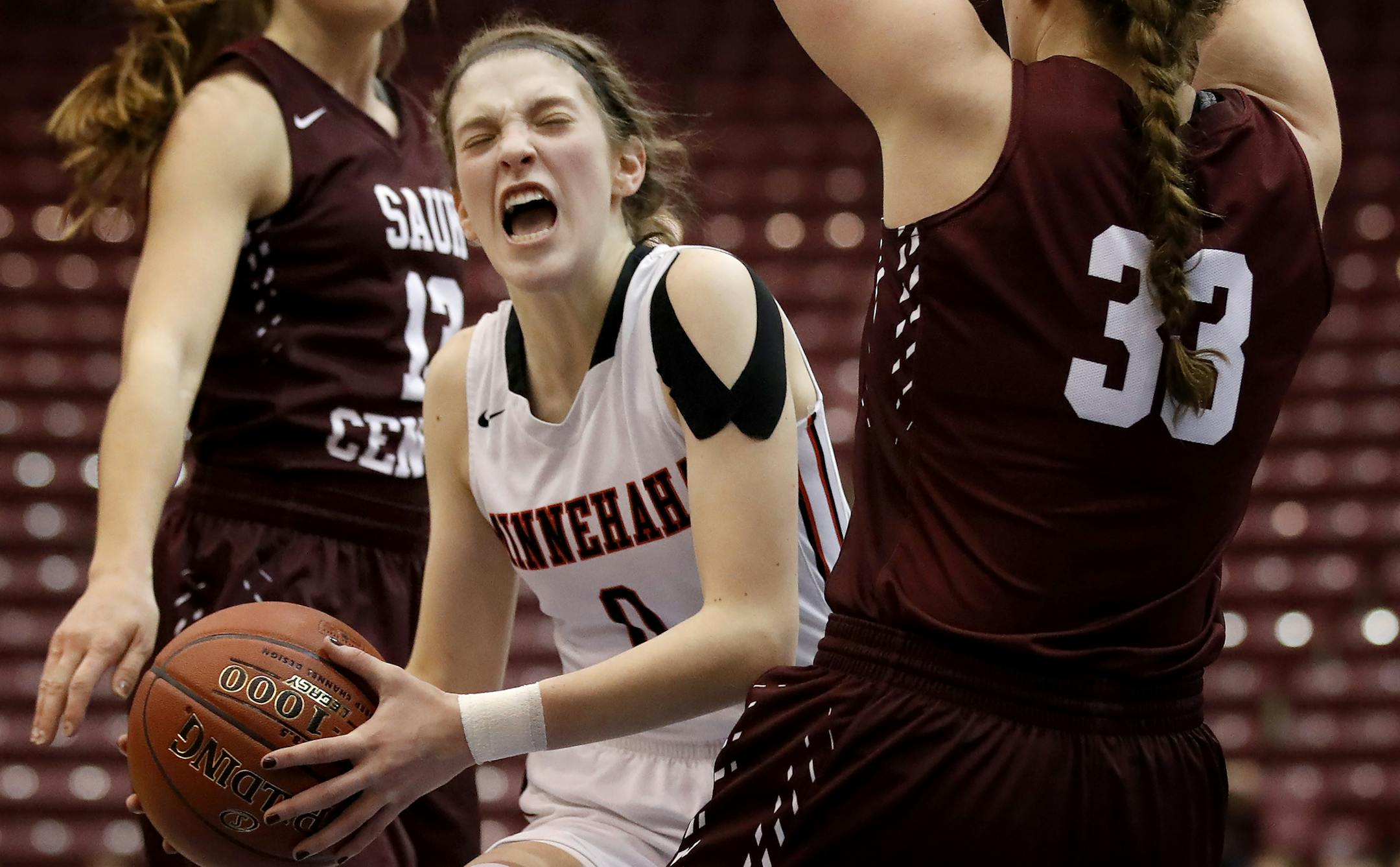Taytum Rhoades (0) of Minnehaha Academy was defended by Alyssa Kohorst (33) of Sauk Centre in the first half. ] CARLOS GONZALEZ ï cgonzalez@startribune.com - March 15, 2017, Minneapolis, MN, Mariucci Arena, girls high school prep basketball, quarterfinal game, Class 2A quarterfinals, Minnehaha Academy vs. Sauk Centre