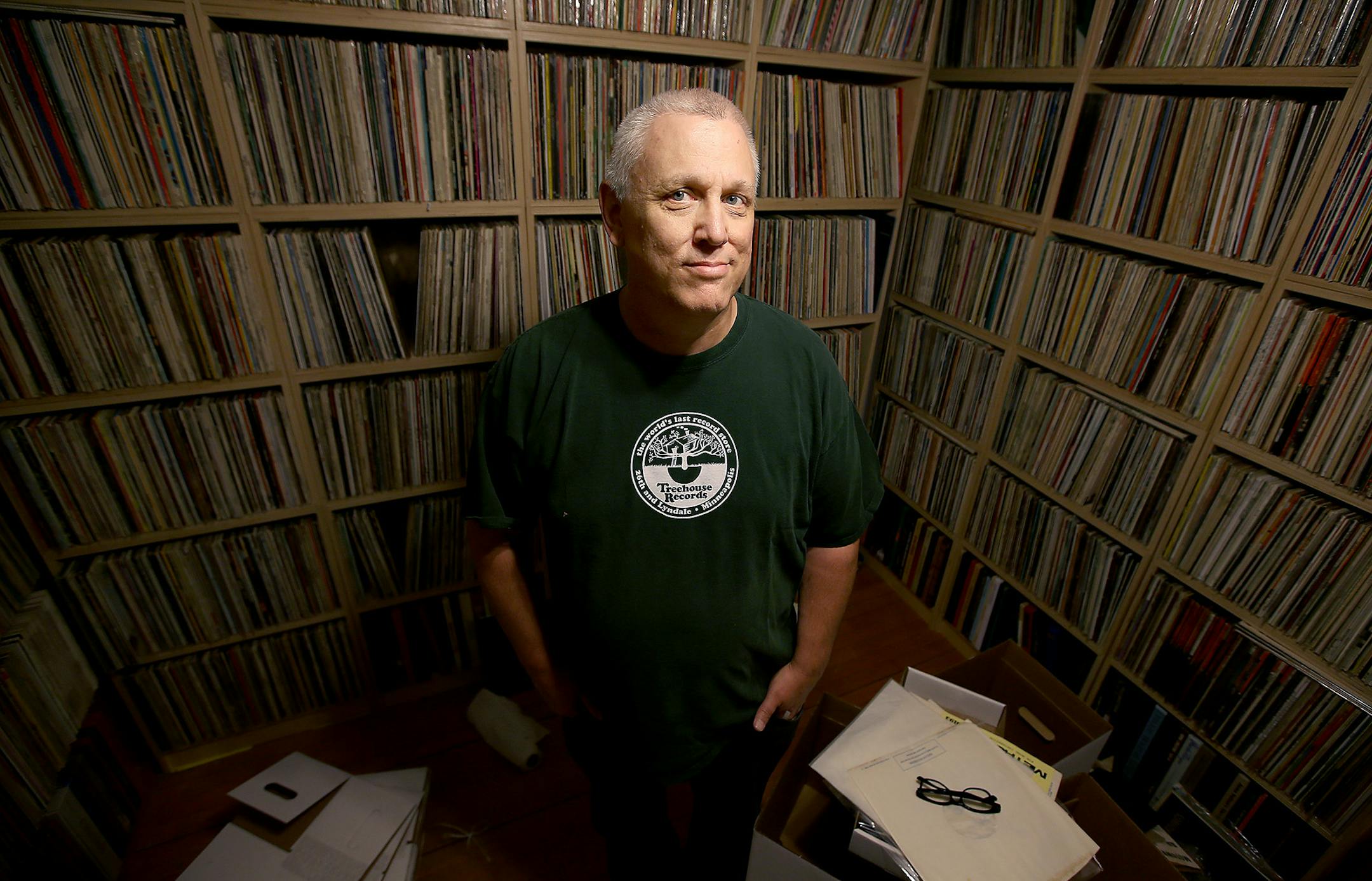 Mark Trehus, a record collector and owner of Treehouse records, was all smiles surrounded by a sea of only part of his record collection, Tuesday, September 23, 2014 in St. Paul, MN. ] (ELIZABETH FLORES/STAR TRIBUNE) ELIZABETH FLORES • eflores@startribune.com