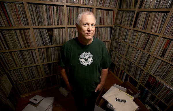 Mark Trehus, a record collector and owner of Treehouse records, was all smiles surrounded by a sea of only part of his record collection, Tuesday, Sep