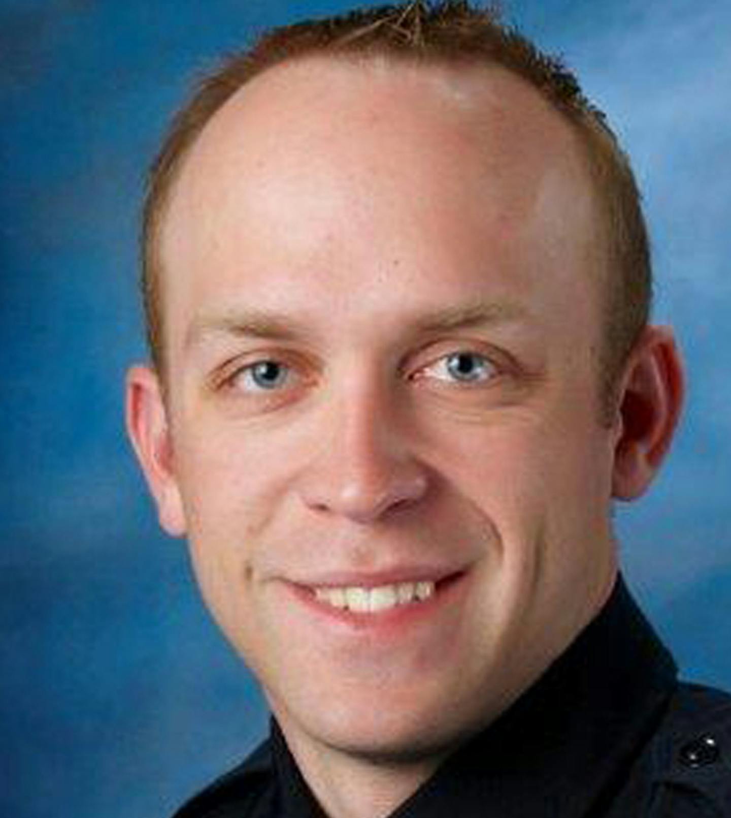 This undated photo released by Fargo Police Department shows Fargo police officer Jason Moszer. Moszer was shot amid a standoff in Fargo, N.D. with a domestic violence suspect, police in North Dakota said early Thursday, Feb. 10, 2016. Moszer, 33, responded to the standoff Wednesday night and parked near the home the suspect was barricaded inside, Fargo Deputy Police Chief Joe Anderson said. (Fargo Police Department via AP) MANDATORY CREDIT