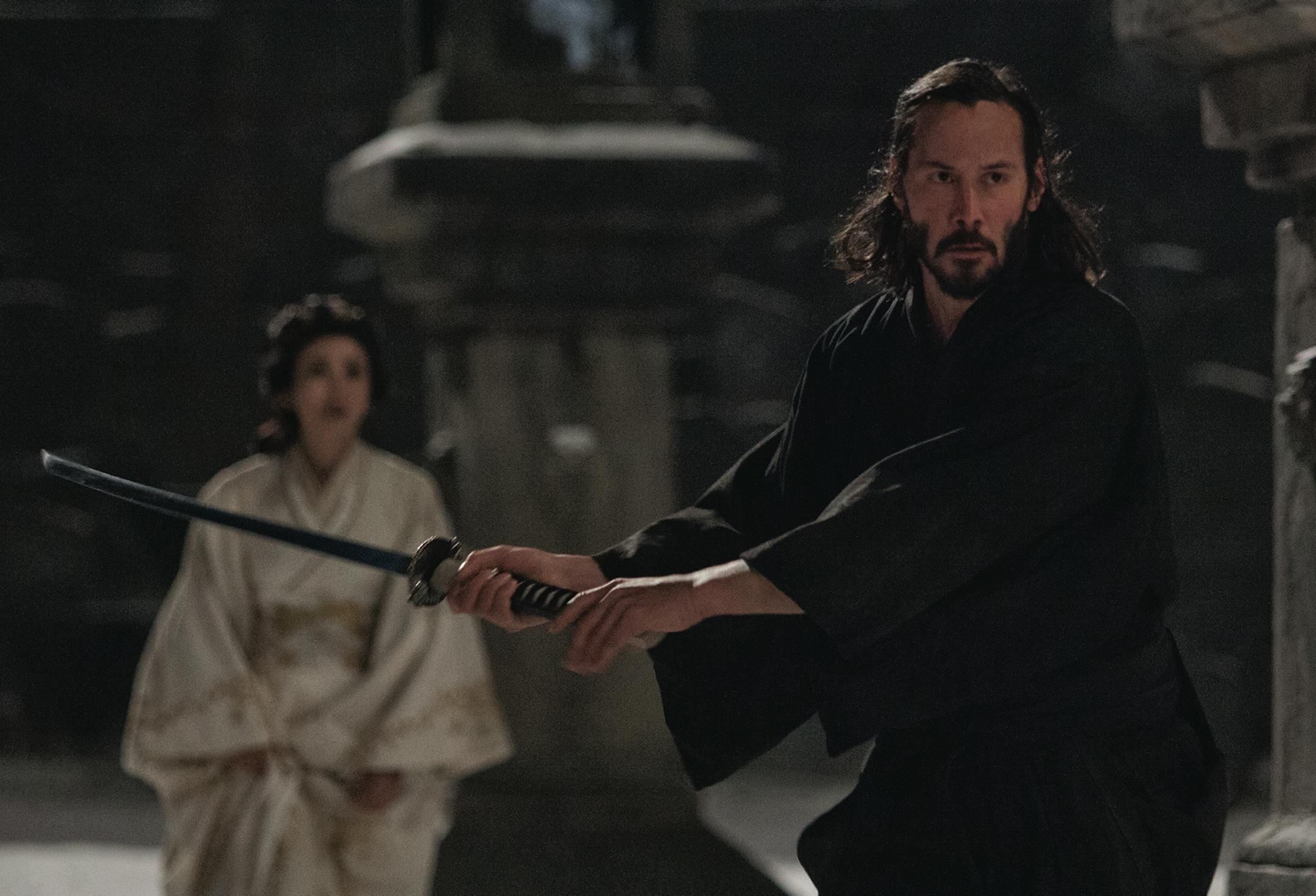Kai (KEANU REEVES) protects Mika (KO SHIBASAKI) in the action-adventure "47 Ronin". Photo Credit: Frank Connor Copyright: ¬© 2013 Universal Studios. ALL RIGHTS RESERVED. ORG XMIT: MIN1312241024183724