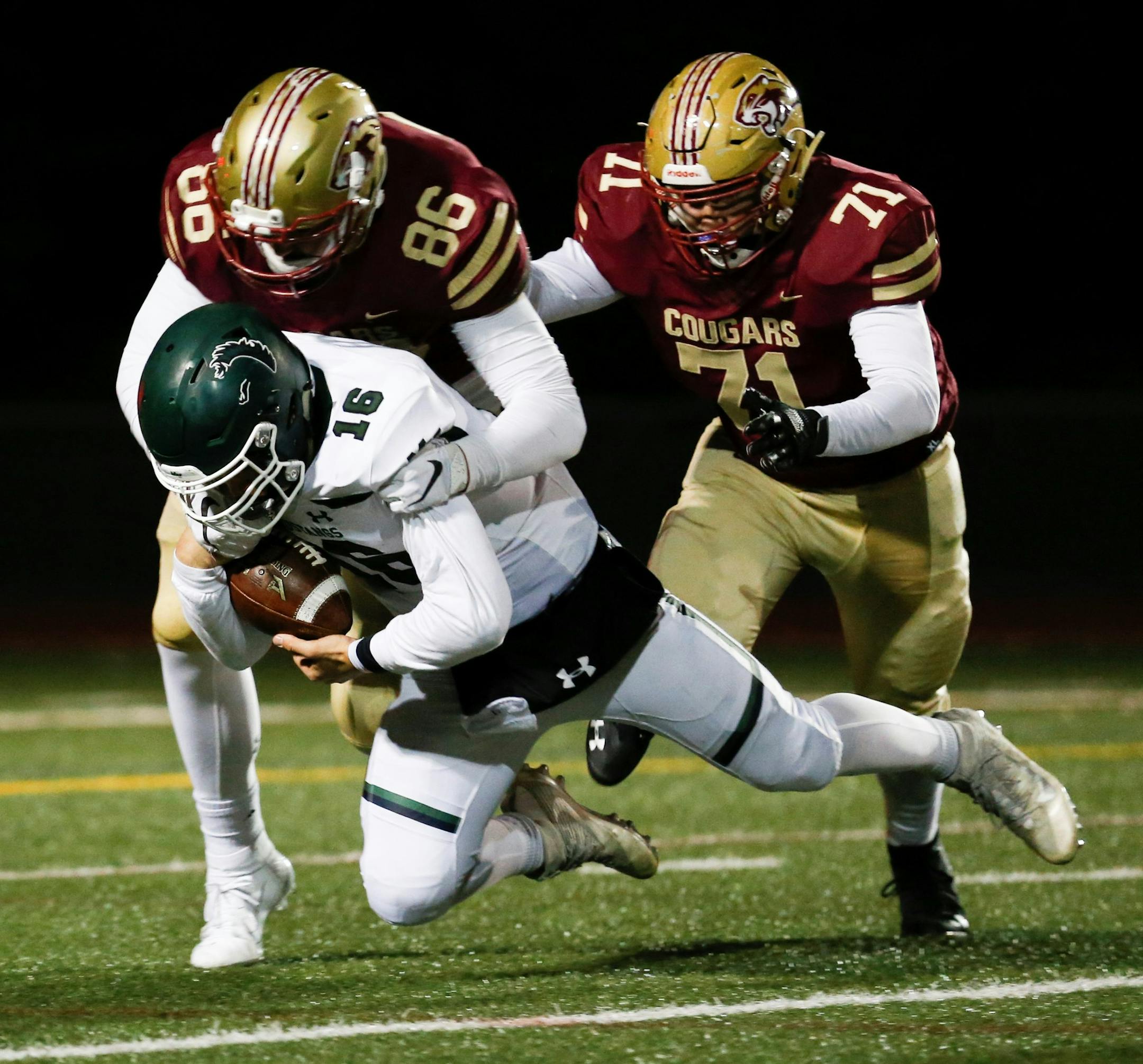 Lakeville South's Riley Mahlman (86) sacks Mounds View’s Cole Stenstrom (16) for a big loss in Friday night’s Class 6A quarterfinal in Eden Prairie. Photo by Jeff Lawler, SportsEngine. Photo by Jeff Lawler, SportsEngine