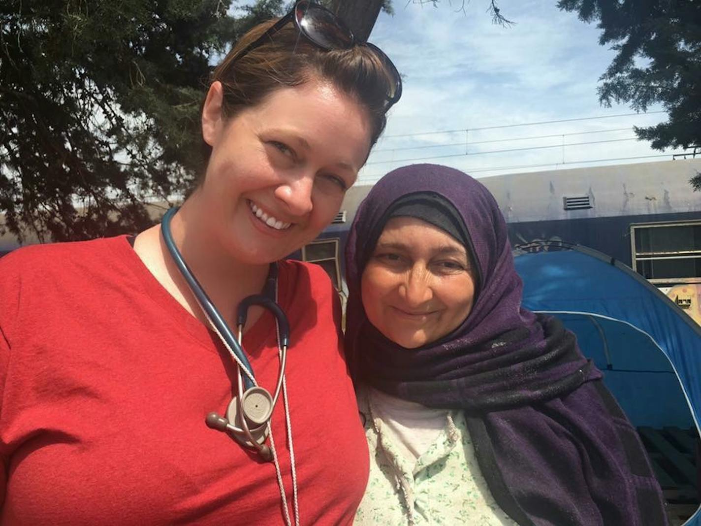 Lindsey Smith and a woman at a refugee camp on the border of Greece and Macedonia in 2016.