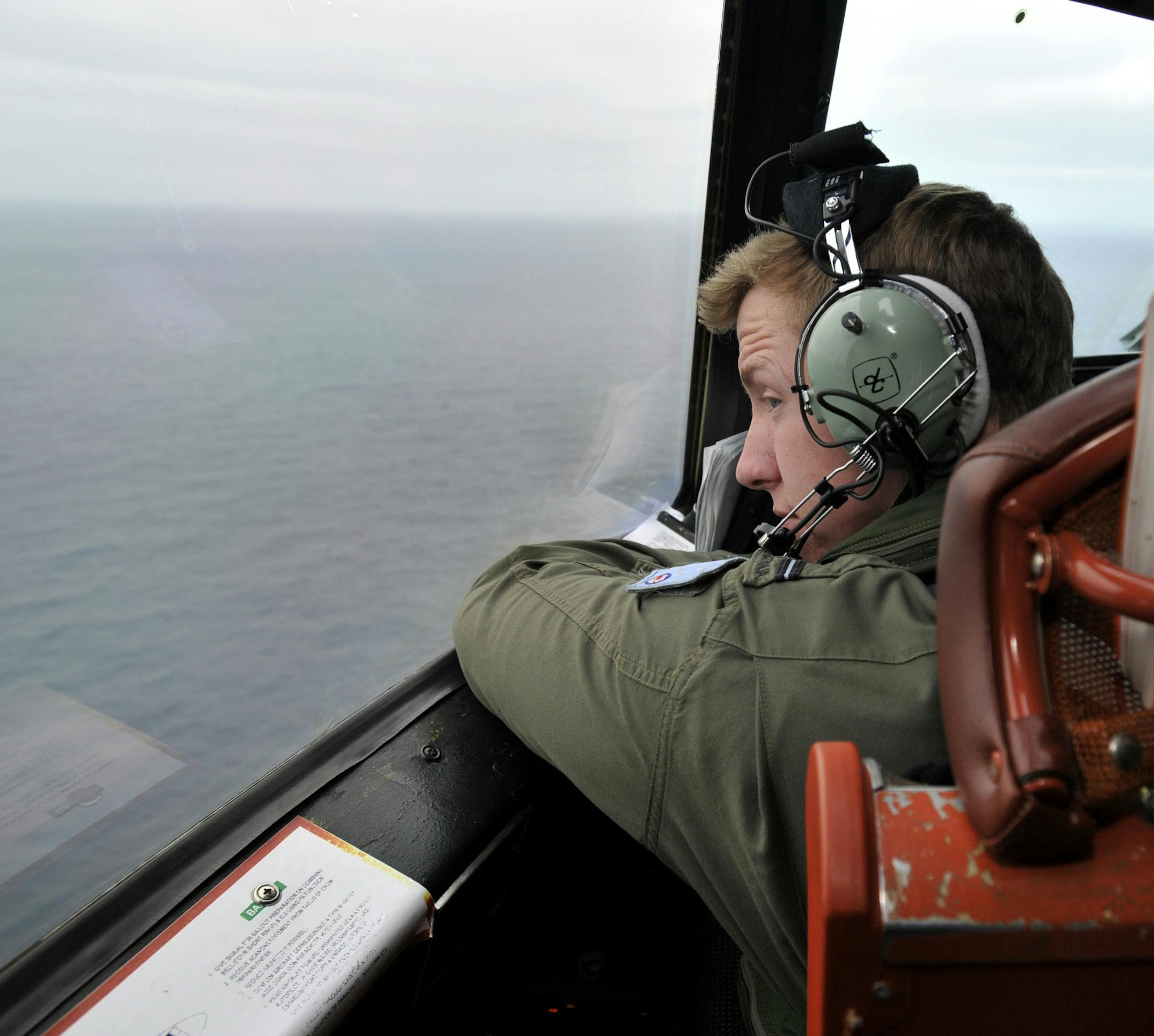 2014 YEAR IN REVIEW - FOR USE AS DESIRED -- Flying Officer Benjamin Hepworth pilots a Royal Australian Air Force AP-3C Orion search plane as part of efforts over the Indian Ocean to spot debris from Malaysia Flight 370, March 21, 2014. (Justin Benson-Cooper/Pool via The New York Times) -- EDITORIAL USE ONLY
