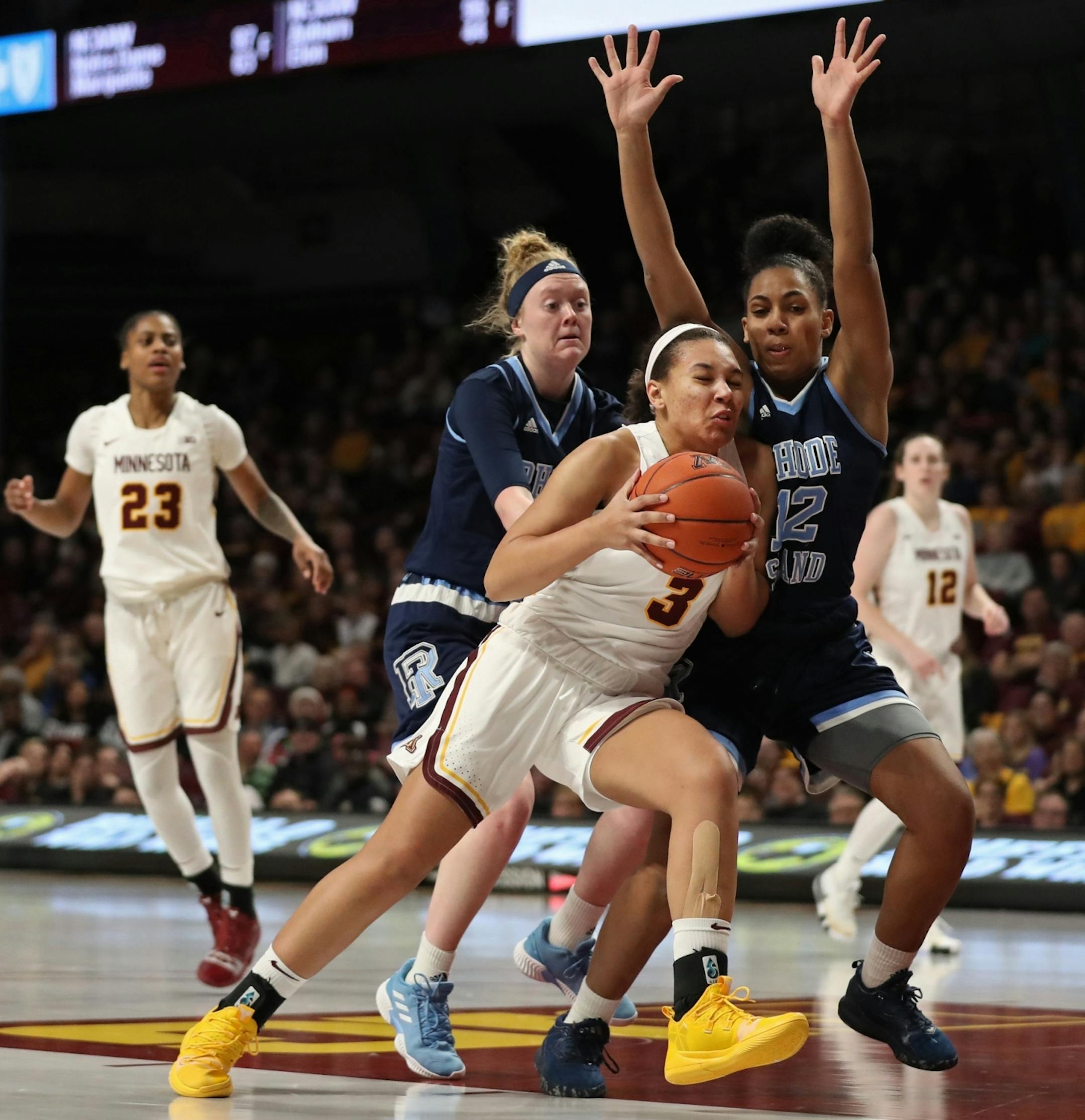 Minnesota Gophers Destiny Pitts (3) was defended by Rhode Island Rams guard Maia Moffitt (12) in the first half.