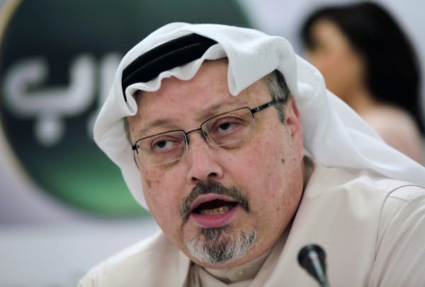 FILE - In this Dec. 15, 2014, file photo, Saudi journalist Jamal Khashoggi speaks during a press conference in Manama, Bahrain. Nearly one year has pa