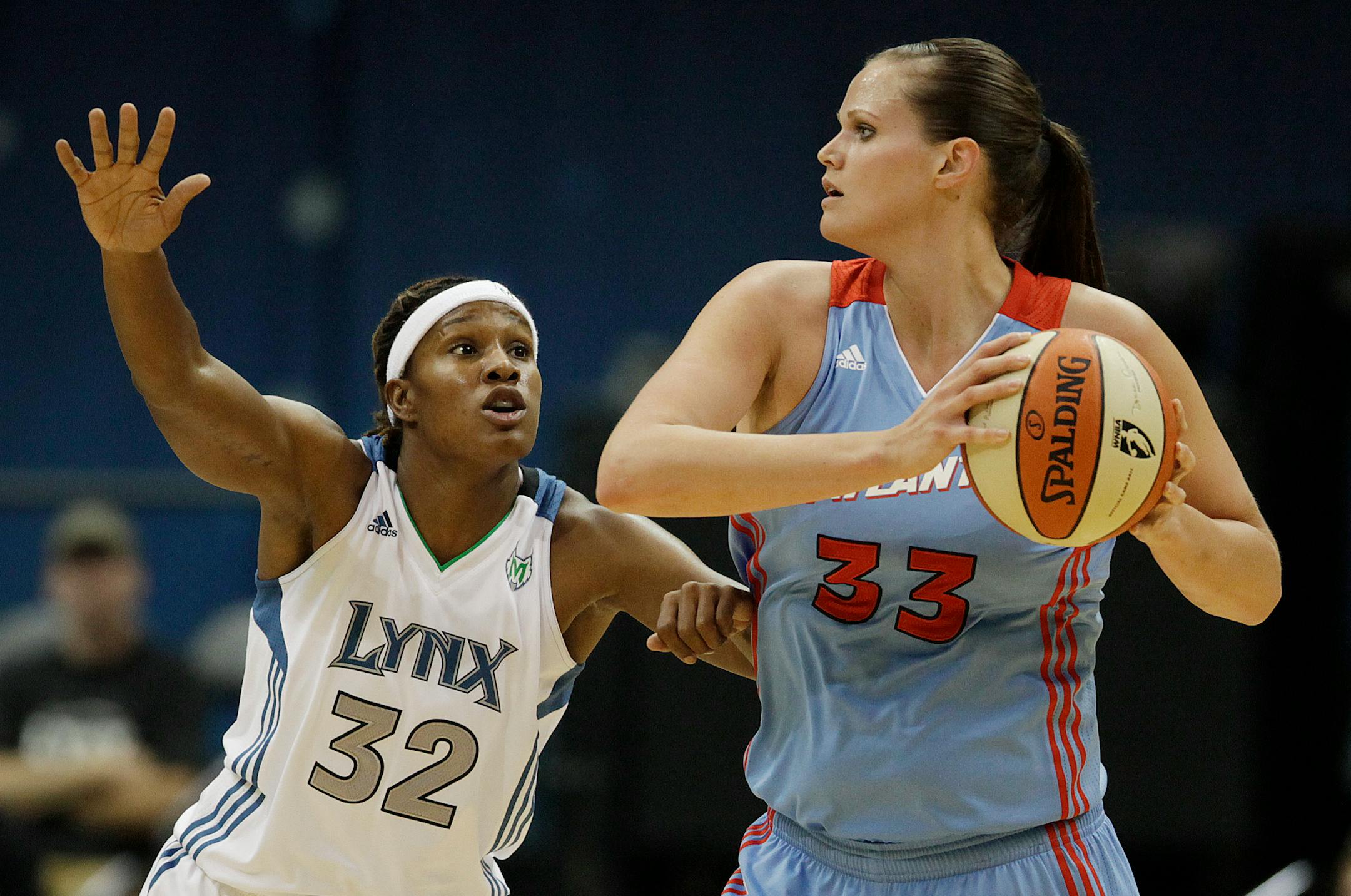 Atlanta Dream forward Allison Bales looks to pass against Minnesota Lynx forward Rebekkah Brunson in the second half of an WNBA basketball game Friday, June, 17 2011, in Minneapolis. (AP Photo/Stacy Bengs)