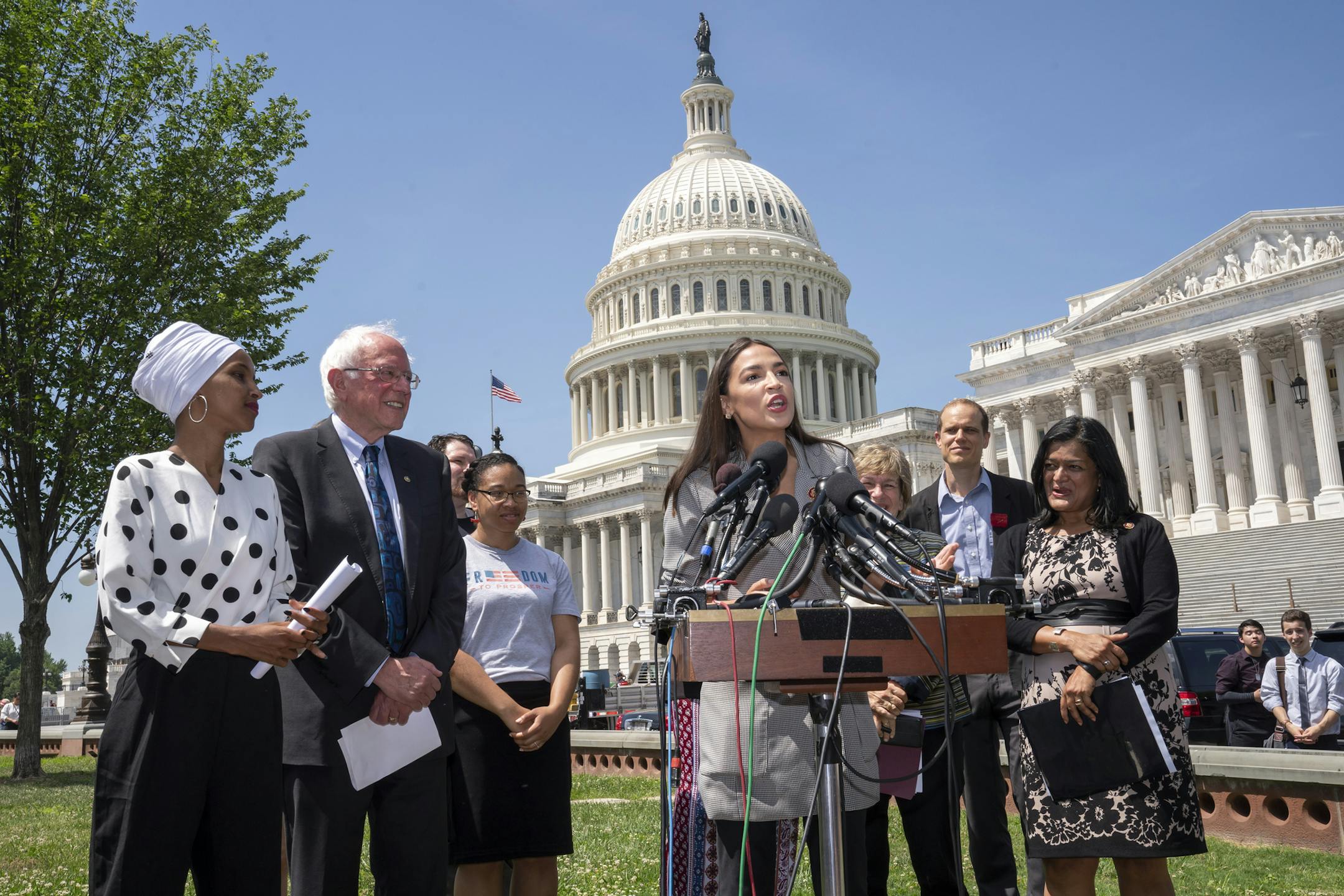 From left, Rep. Ilhan Omar, D-Minn., Democratic presidential candidate, Sen. Bernie Sanders, I-Vt., and Rep. Pramila Jayapal, D-Wash., far right, listen as Rep. Alexandria Ocasio-Cortez, D-N.Y., center, joins them in a call for legislation to cancel all student debt, at the Capitol in Washington, Monday, June 24, 2019. (AP Photo/J. Scott Applewhite)