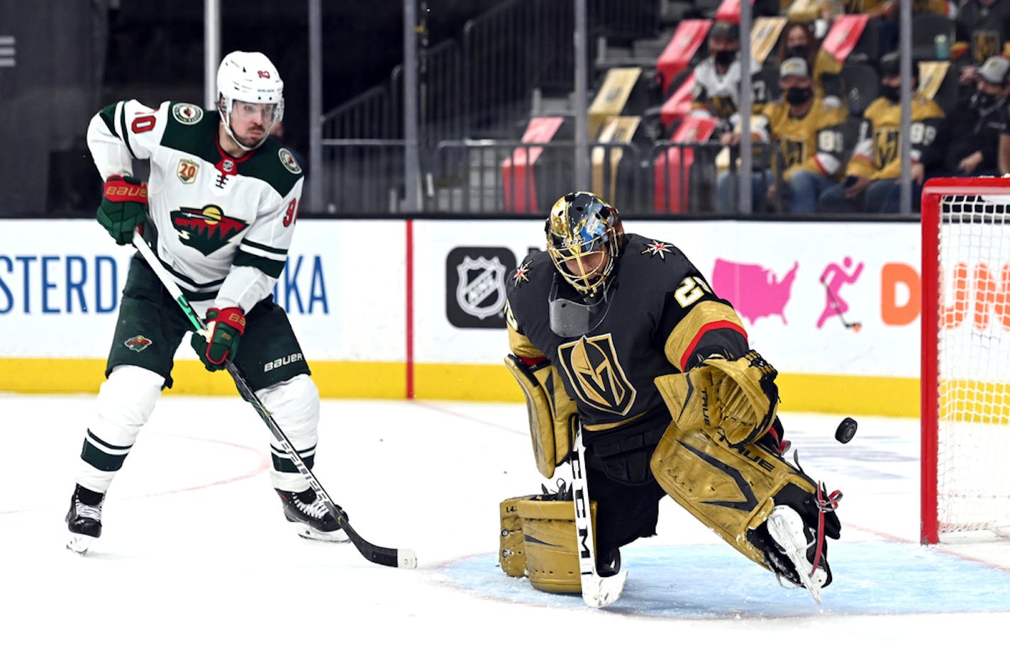 Vegas goaltender Marc-Andre Fleury (29) deflects the puck against Minnesota Wild center Marcus Johansson during Game 2.