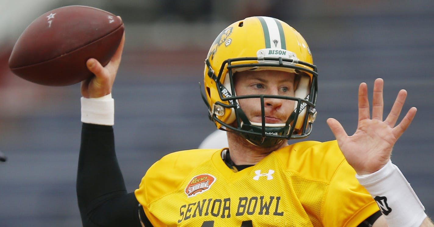 North Dakota State quarterback Carson Wentz of (11) sets back to pass during drills at an NCAA college football practice for the Senior Bowl, Wednesday, Jan. 27, 2016, at Ladd&#x2013;Peebles Stadium, in Mobile, Ala. (AP Photo/Brynn Anderson)