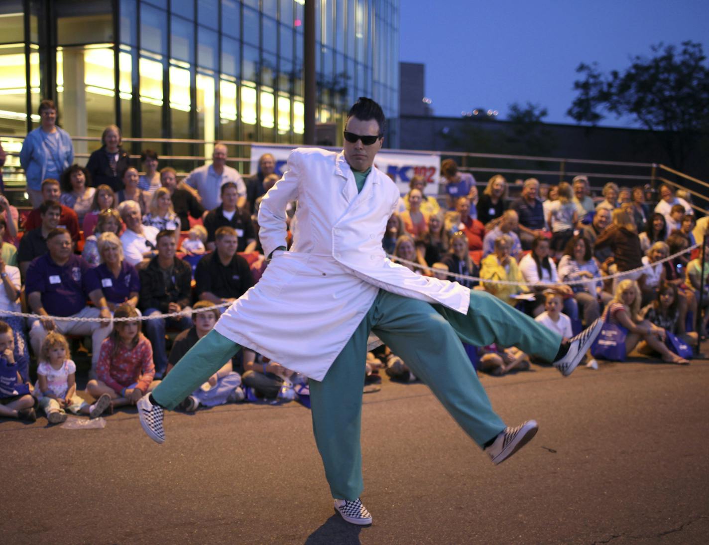 JEFF WHEELER &#x2022; jwheeler@startribune.com MINNEAPOLIS - 7/22/09 - Minneapolis celebrated the 70th Aquatennial with the torchlight parade down Hennepin Ave. Wednesday night. Thousands lined the street on a perfect night. IN THIS PHOTO: ] Rudy Coby mystified parade viewers with his four-legged character as he marched in the Valleyfair Amusement Park contingent in the Torchlight Parade Wednesday night.