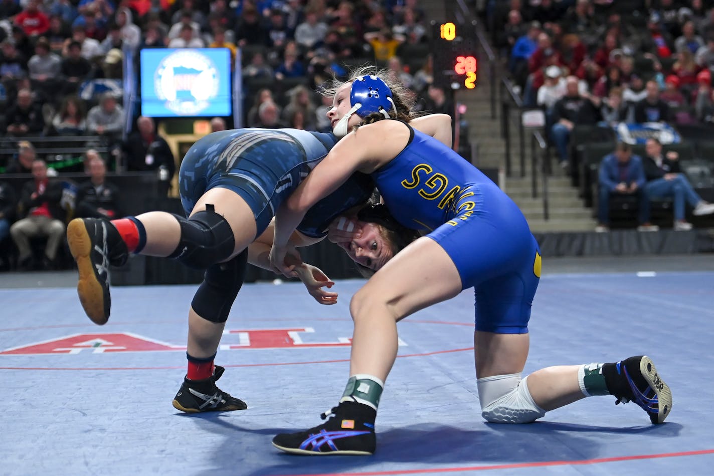 Hastings' Skylar Little Soldier, right, wrestles Bemidji's Kylie Donat in the 132lb final during the Minnesota State High School girls Wrestling Championships Saturday, March 5, 2022 at Xcel Energy Center in St. Paul, Minn. Little Soldier won with a pin. ] AARON LAVINSKY • aaron.lavinsky@startribune.com