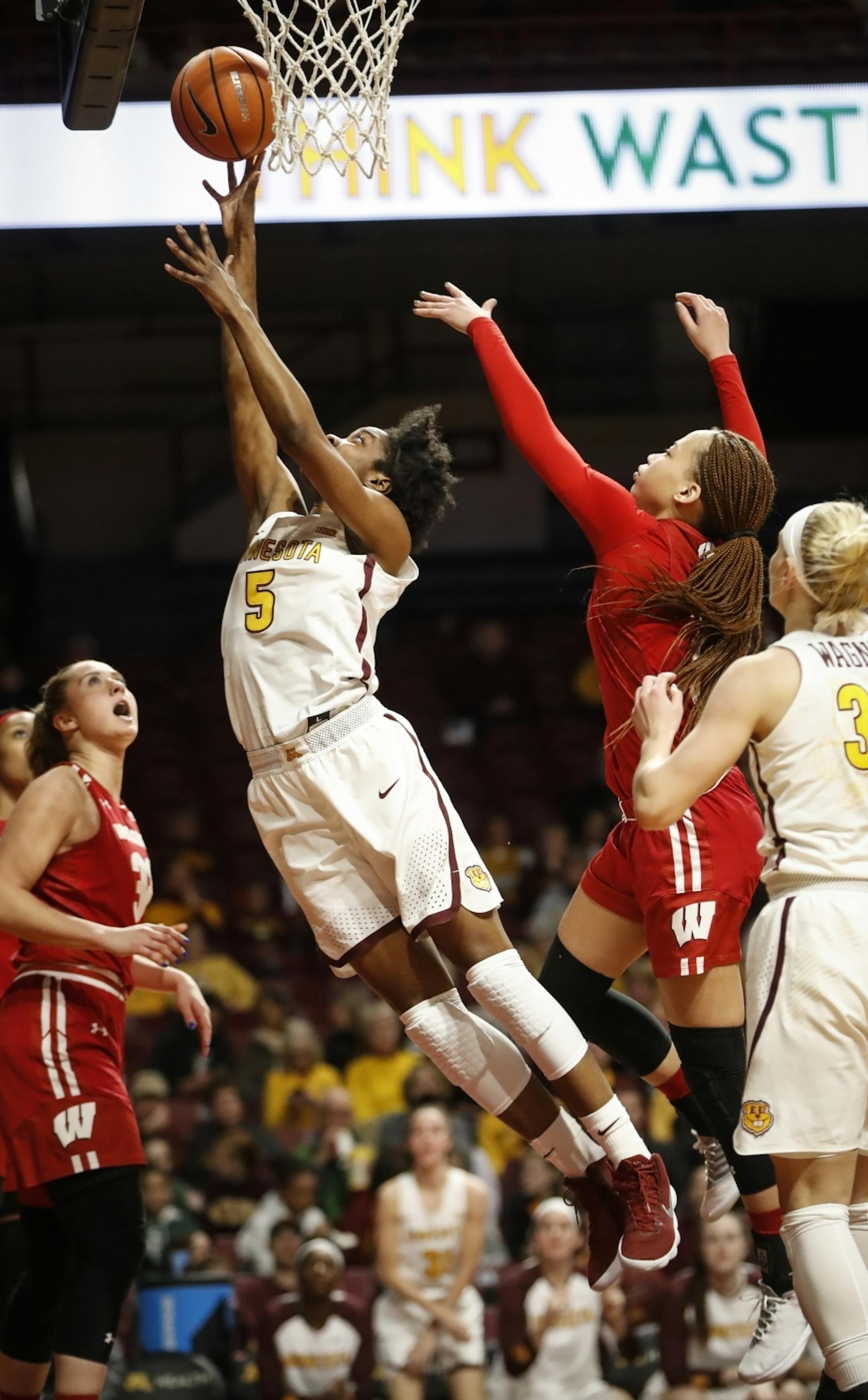 Minnesota Golden Gophers forward Taiye Bello (5) jumped for a lay up in the second half.