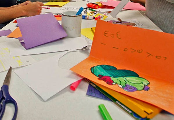 Students work on Valentine's Day cards at school in this file photo.