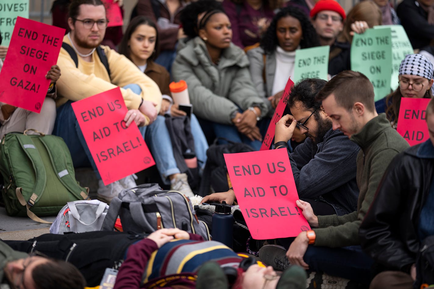 Students staged a die-in and moment of silence outside Coffman Memorial Union during a national student walkout in support of Palestine at the University of Minnesota in Minneapolis, Minn. on Wednesday, Oct. 25, 2023. ] LEILA NAVIDI • leila.navidi@startribune.com