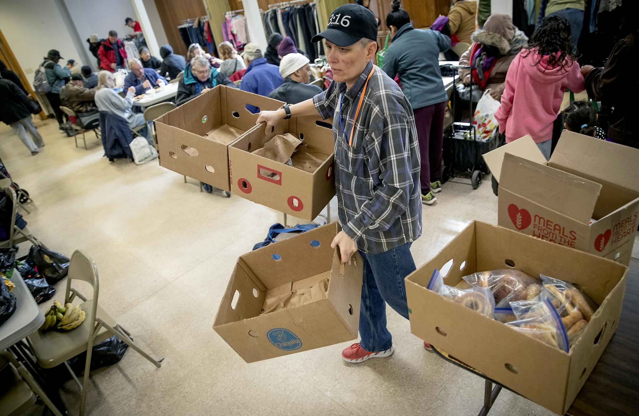 Open Hands Midway Director Kay Kuehn, removed boxes that were once filled with food but quickly were taken at their location, Monday, March 25, 2019 in St. Paul, MN Open Hands is housed at Bethlehem Lutheran Church, serves a meal to area homeless and poor residents. They also have a nurse on site and give away groceries and clothing. Organizers worry that the stadium development may squeeze these folks to stop showing up. ] ELIZABETH FLORES • liz.flores@startribune.com