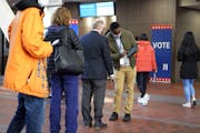 Voters checked in to vote at the Hennepin County Government Center, Oct. 27, 2020.
