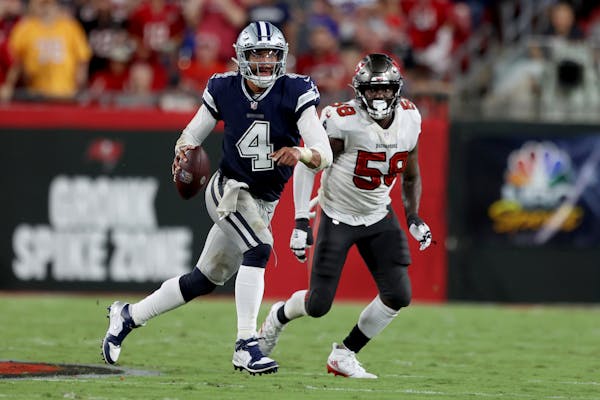 Dallas Cowboys quarterback Dak Prescott (4) throws a pass during an NFL football game against the Tampa Bay Buccaneers, Thursday, Sept 9, 2021 in Tamp