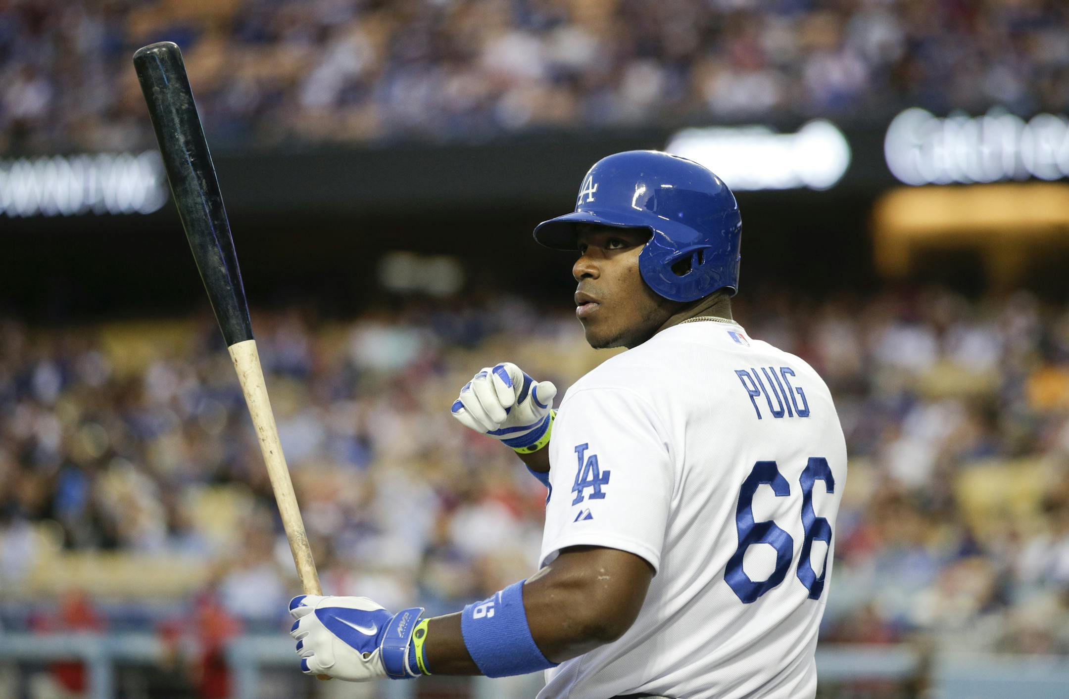 Los Angeles Dodgers' Yasiel Puig gets ready for his at-bat during the first inning of a baseball game against the Philadelphia Phillies on Thursday, April 24, 2014, in Los Angeles. (AP Photo/Jae C. Hong)