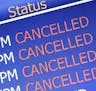 Cancelled flights on airport monitor. istock