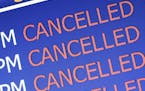 Cancelled flights on airport monitor. istock