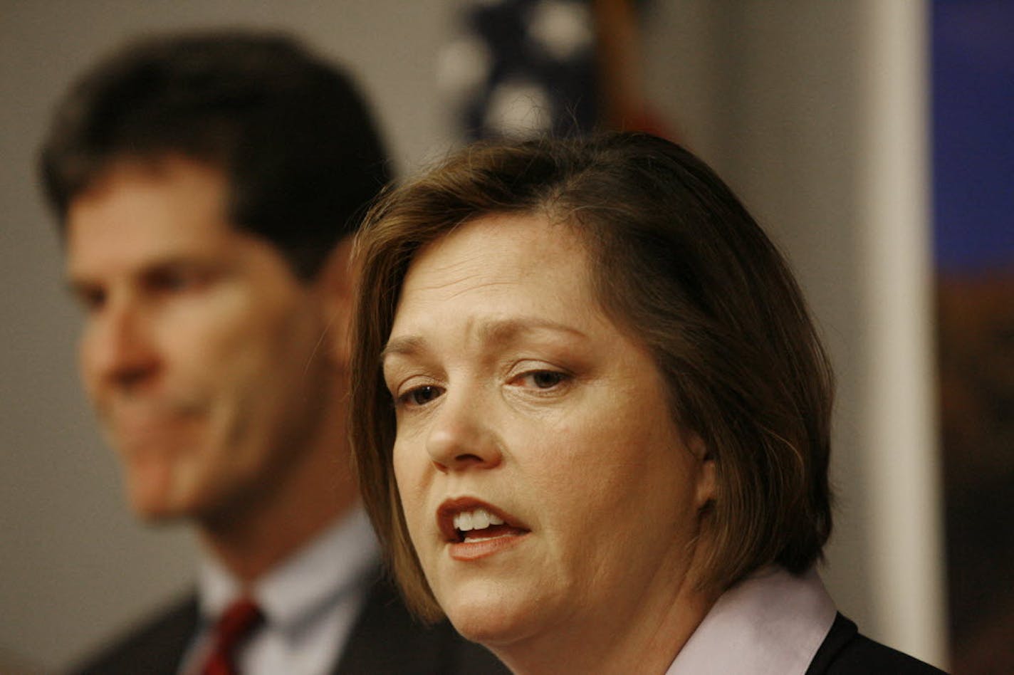 House Speaker Margaret Anderson Kelliher, right, and Senate Majority Leader Larry Pogemiller talk about the proposed balanced-budget solution.