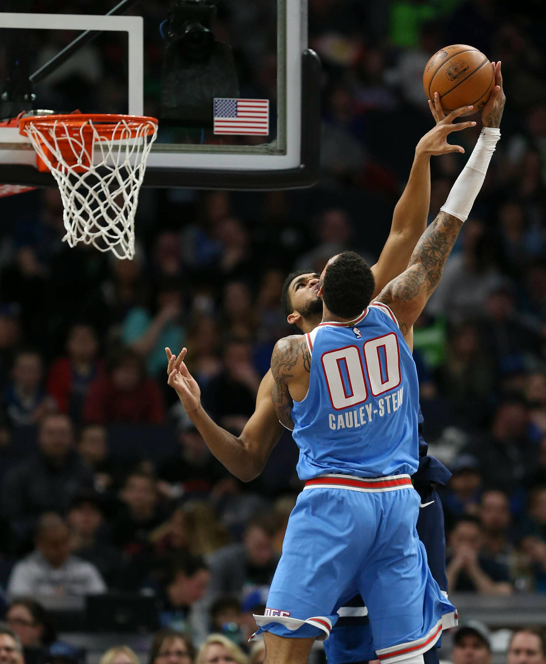 Minnesota Timberwolves center Karl-Anthony Towns (32) tried to block a second quarter show by Sacramento Kings center Willie Cauley-Stein (00).