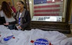 Beth Benti, a Second Chance Coalition board member, handed out t-shirts during the "Second Chance Day on the Hill Rally," Thursday, February 7, 2019 i
