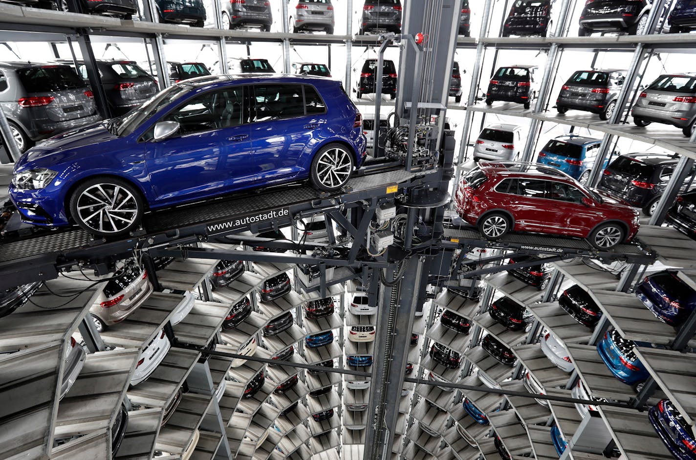 Volkswagen cars are lifted inside a delivery tower of the company in Wolfsburg, Germany, Tuesday, March 14, 2017. The CEO of German automaker Volkswagen says the United States remains a "core market" for the company despite its diesel emissions scandal and has underlined that it hopes to expand there.