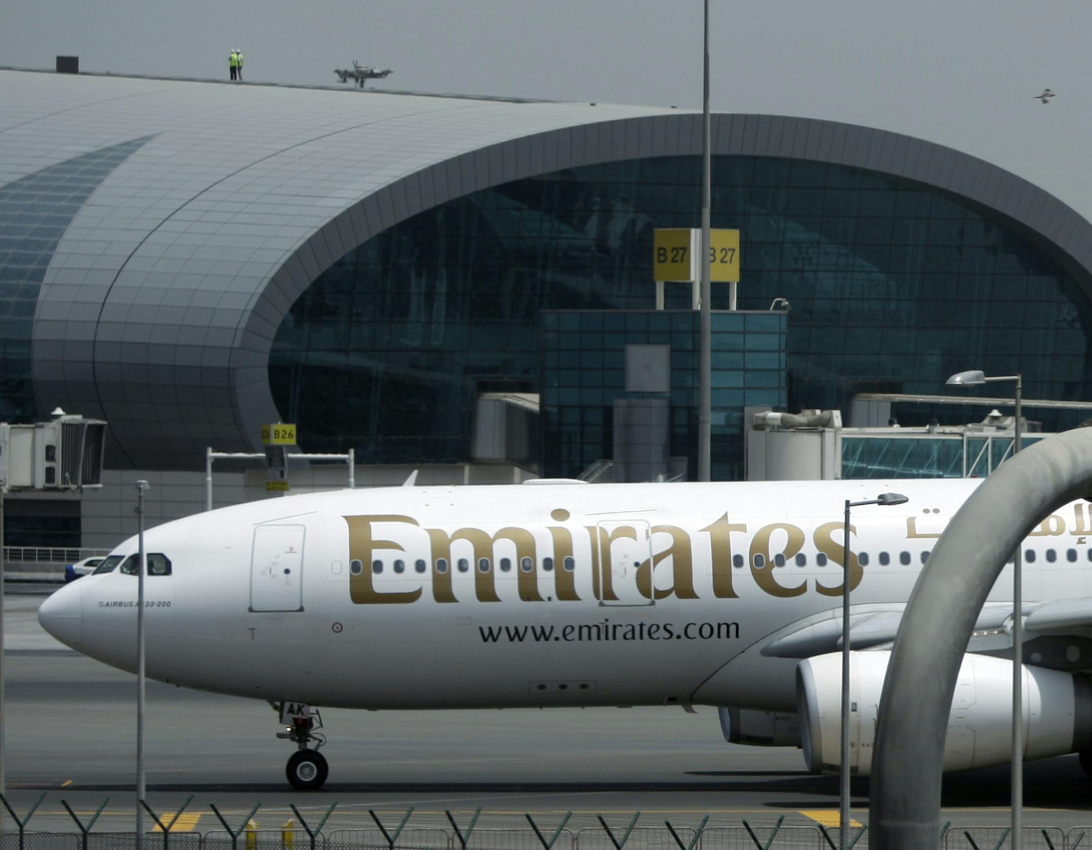 An Emirates passenger flight taxis at the Dubai International Airport in Dubai, United Arab Emirates, Wednesday, May 12, 2010. Emirates airlines says its net profit more than tripled to US$1.1 billion for the year ending March 31, compared with $325 million for same period in 2008-9.(AP Photo/Kamran Jebreili) ORG XMIT: MIN2015042715225249