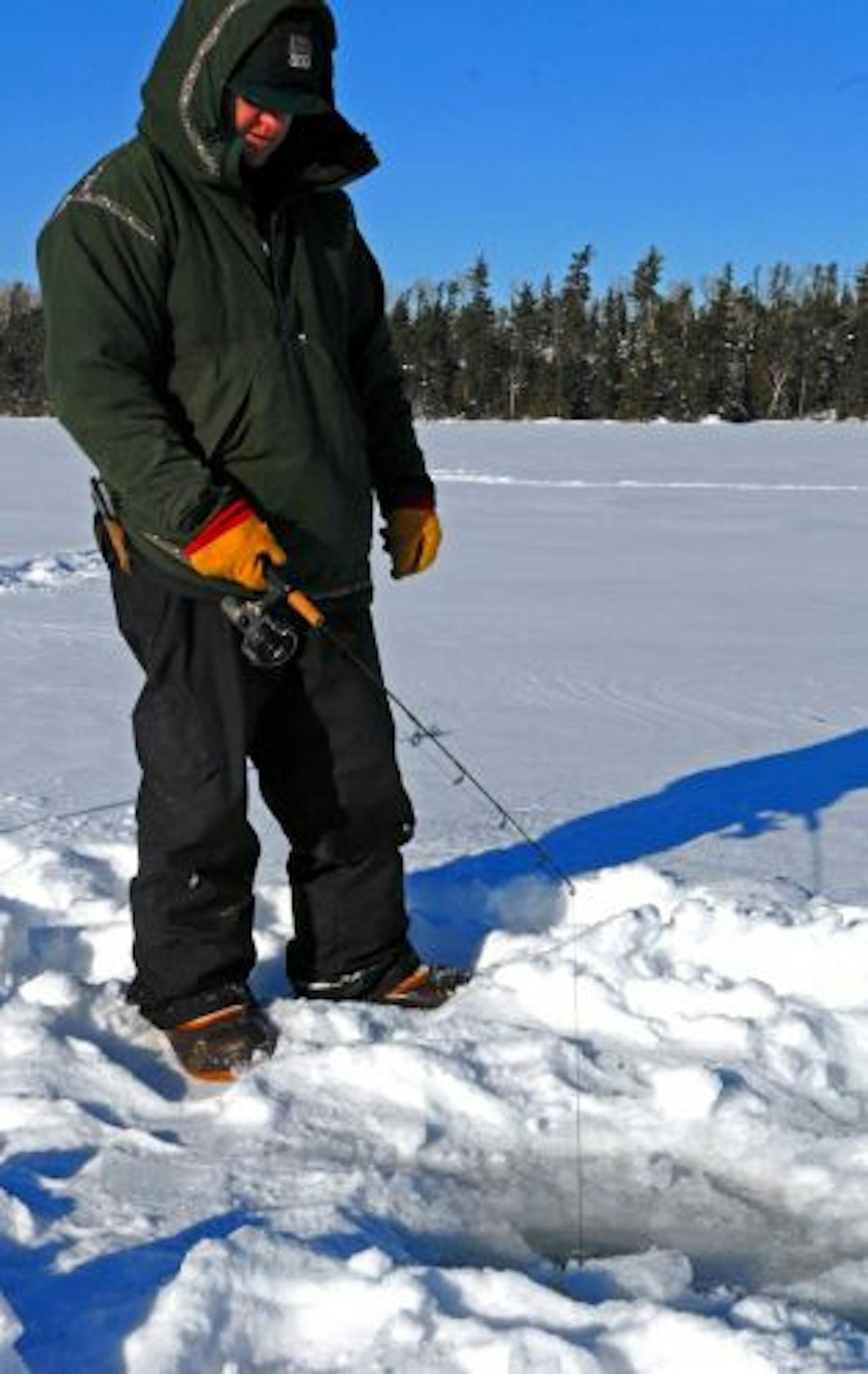 Stu McEntyre of Ely jigged for lake trout on Knife Lake. The frigid water was about 60 feet deep where McEntyre fished, and he was jigging a frozen cisco about 45 feet down.
