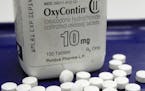 FILE - This Feb. 19, 2013, file photo shows OxyContin pills arranged for a photo at a pharmacy in Montpelier, Vt. Purdue Pharma, the maker of the pres