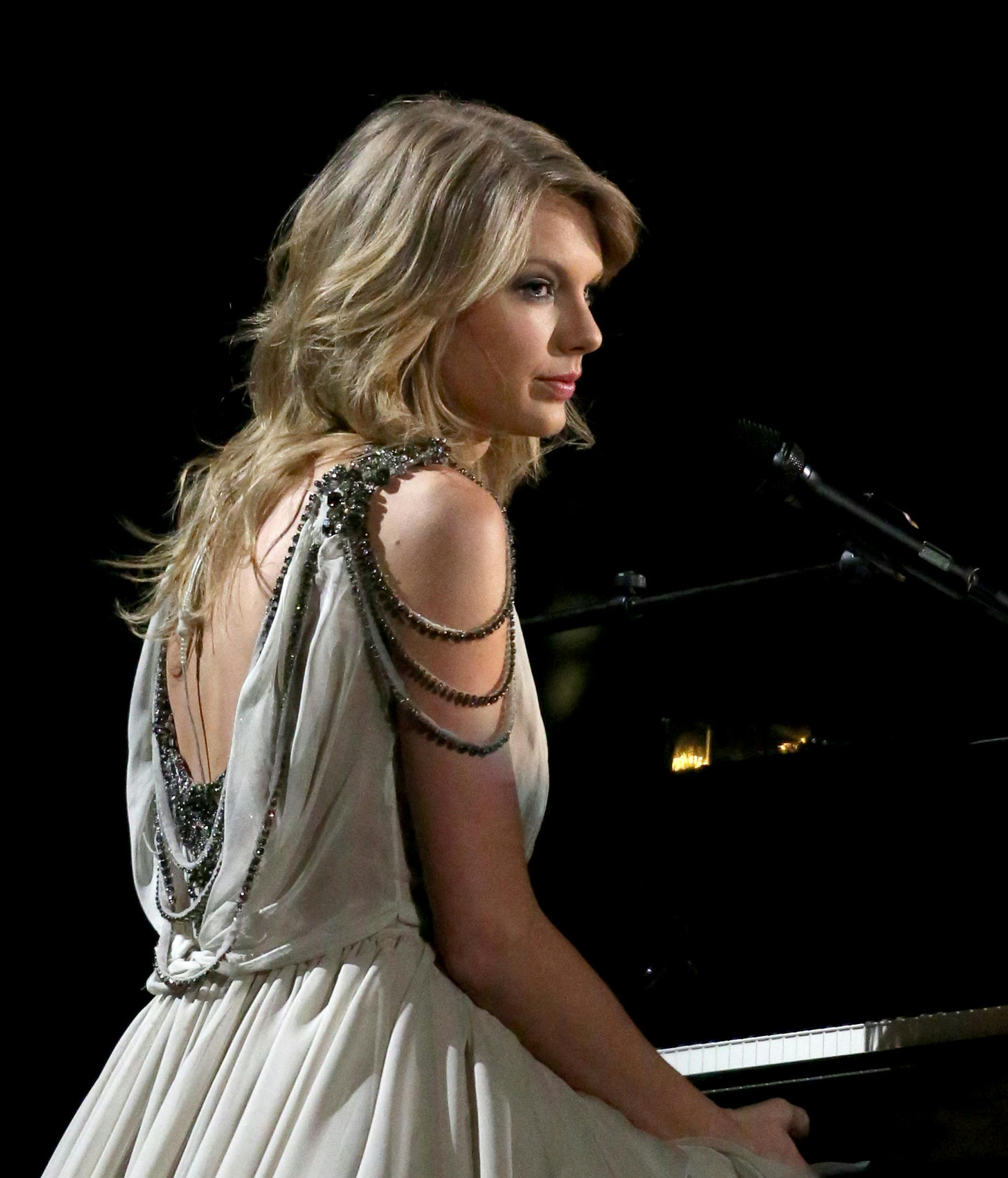 Taylor Swift performs on stage at the 56th annual GRAMMY Awards at Staples Center on Sunday, Jan. 26, 2014, in Los Angeles. (Photo by Matt Sayles/Invision/AP) ORG XMIT: INVW