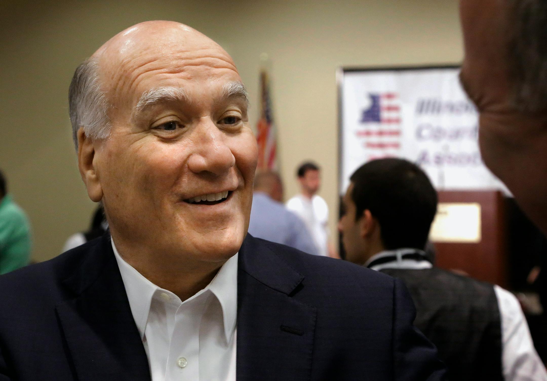 FILE - In this Aug. 14, 2013 file photo, Former White House chief of staff William Daley, then a candidate for governor, speaks with supporters in Springfield.