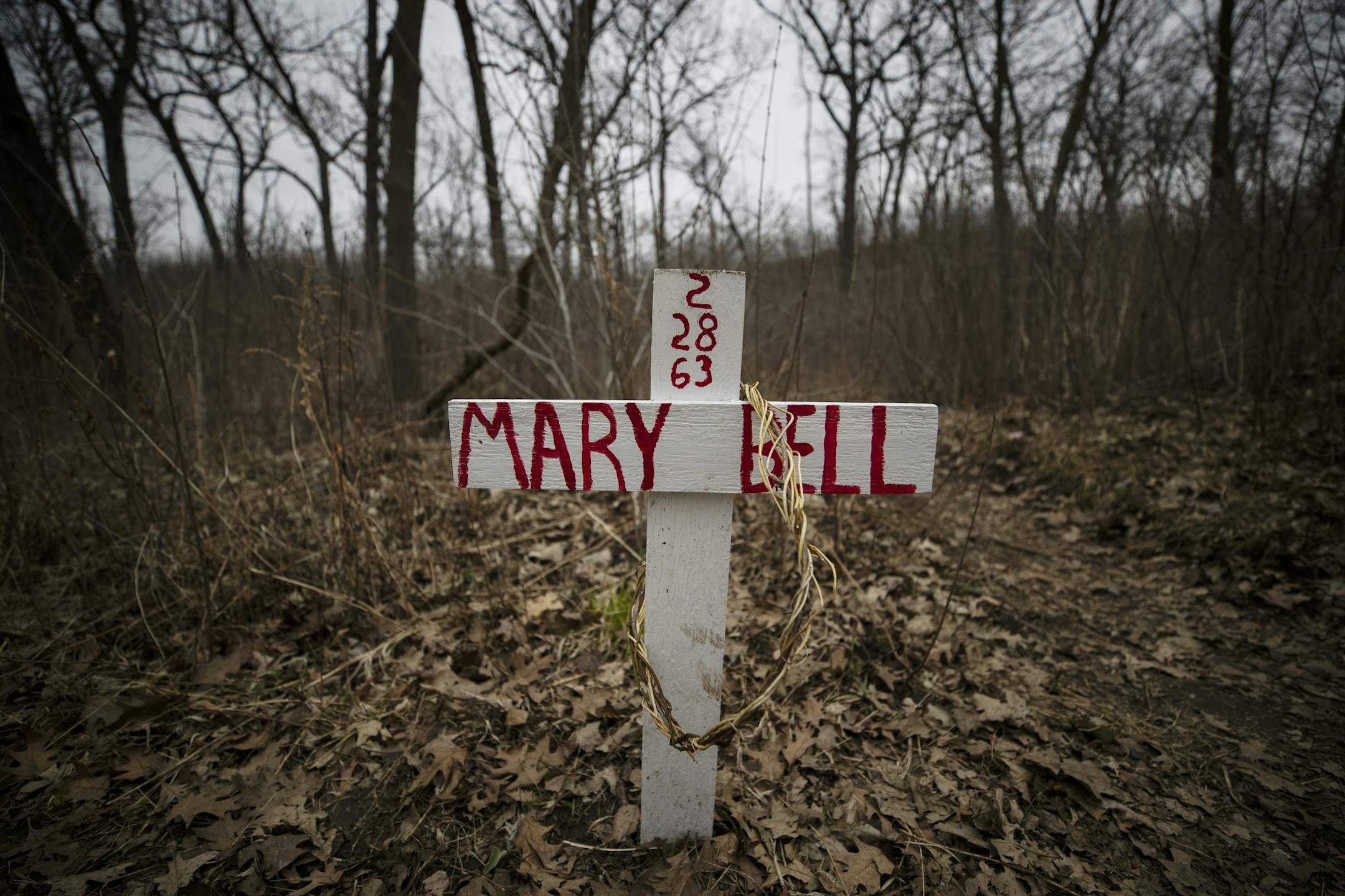 A small wooden cross with the name of a teenage girl killed 57 years ago has appeared at the spot in Minnehaha Park where he body was found.