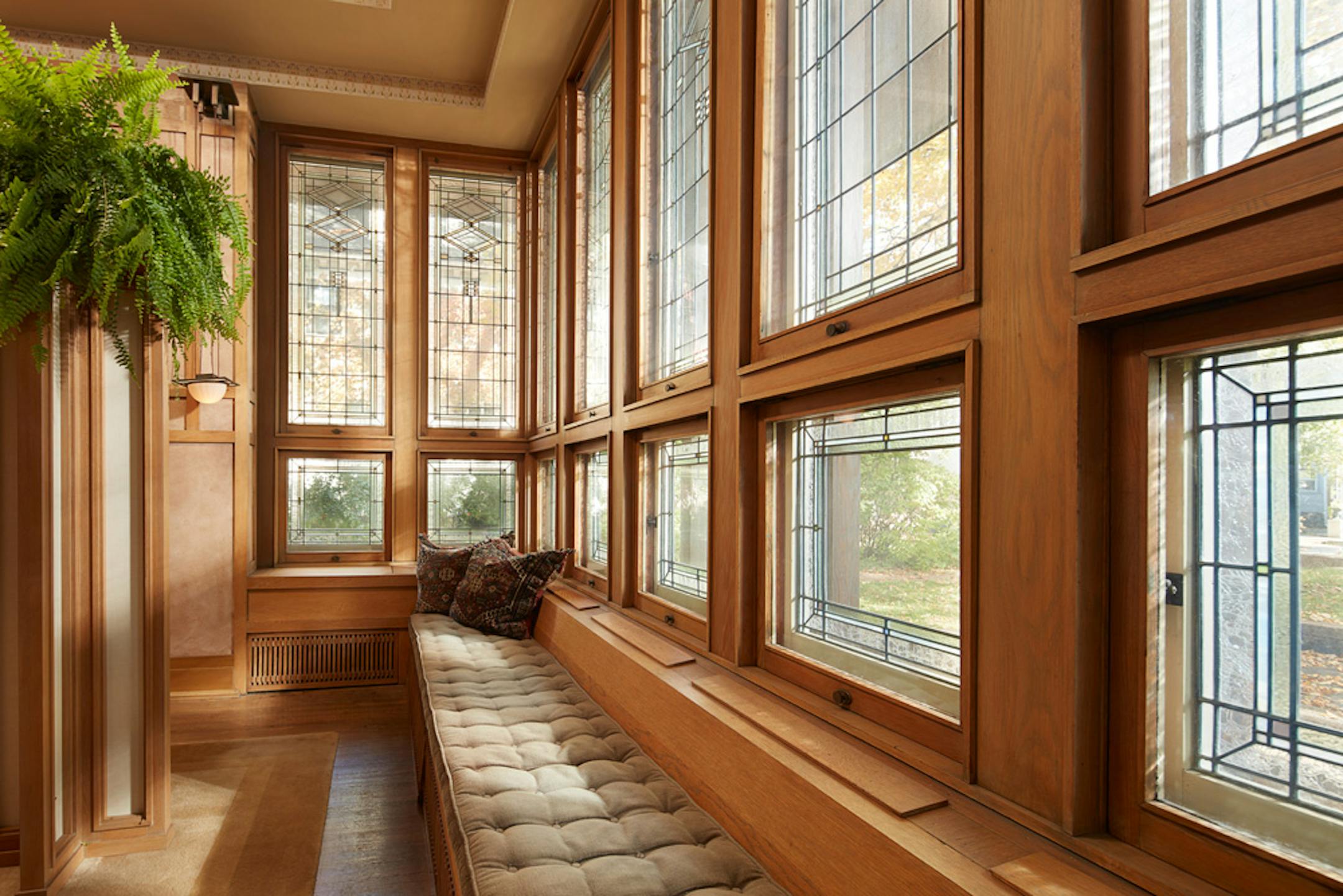 Purcell-Cutts House, 2328 Lake Place, Minneapolis, Minnesota, 1913, William Gray Purcell, Architect.George Elmslie, George Feick Jr. partners in firm Purcell, Feick and Elmslie, Edna S. Purcell House, Prarie School Style, Open floor plan, Art Glass windows, Writing Nook, Fireplace wall Mural by Charles Livingston Bull, Louisana Herons Flying with two Moons, Iridescent glass mortered in frieplace base, Stencil pattern, Peak a Book stained glass entry, Grandfather Gray portrait by Lawton Parker in Entrance Hall, Dining room Art Glass double door to screend-in Porch, Reflecting Pool and landscape designed by Harry Franklin Baker, Living room, Stair Hall, Master Suite, Sleeping Porch, Built in cedar floor storage, fireplace, childrens room connected to master with accordian style operating partition, sunken Living room,tent Ceilings, Ceiling Lights and art glass by Mosaic Art Shops Minneapolis, Maid Call Button, Air conditioning, Central vacuum system, sliding kitchen door operated by foot button, icebox in kitchen with door to outside, custom Sitting chair, Custom Floor lamp, Custom Dining room table,chairs and sideboard, Custom Cluster Pendant lighting, Oak hardwood floors and trim, Custom Throw rugs, Continuous tented roof and ceiling, Elevated dining room, dropped floor living room, "Little Joker", Personalized home with monogram ESP for Edna S. Purcell,
