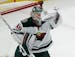 Minnesota Wild's Devan Dubnyk makes a save against the Chicago Blackhawks during the first period of an NHL hockey game Thursday, Oct. 12, 2017, in Ch