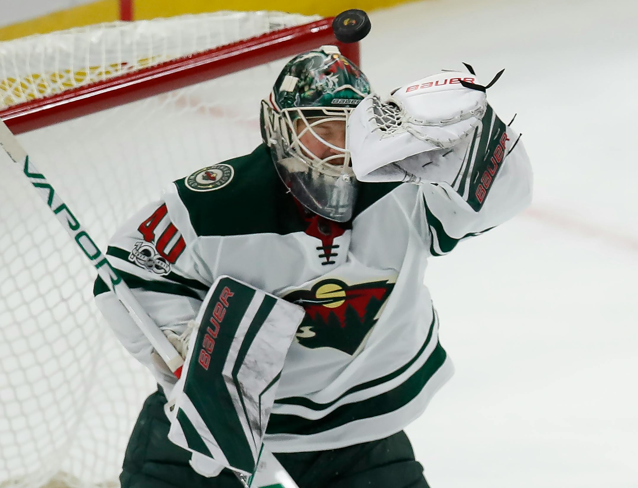 Minnesota Wild's Devan Dubnyk makes a save against the Chicago Blackhawks during the first period of an NHL hockey game Thursday, Oct. 12, 2017, in Chicago. (AP Photo/Jim Young)